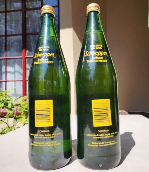 FIGHTING MALARIA WITH TWO FULL VINTAGE GLASS BOTTLES OF SCHWEPPES INDIAN TONIC WATER