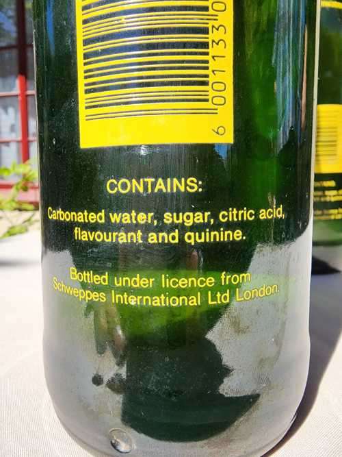 FIGHTING MALARIA WITH TWO FULL VINTAGE GLASS BOTTLES OF SCHWEPPES INDIAN TONIC WATER
