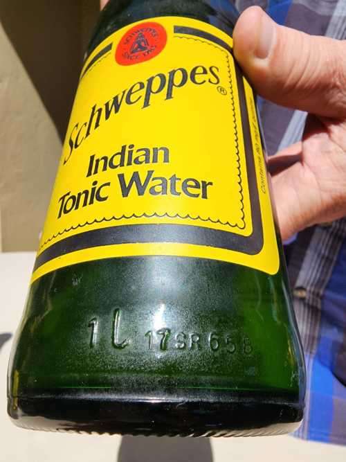FIGHTING MALARIA WITH TWO FULL VINTAGE GLASS BOTTLES OF SCHWEPPES INDIAN TONIC WATER
