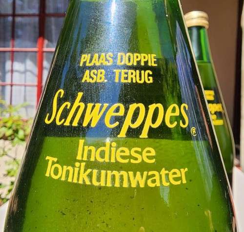 FIGHTING MALARIA WITH TWO FULL VINTAGE GLASS BOTTLES OF SCHWEPPES INDIAN TONIC WATER