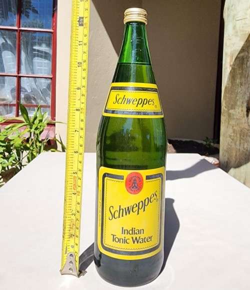 FIGHTING MALARIA WITH TWO FULL VINTAGE GLASS BOTTLES OF SCHWEPPES INDIAN TONIC WATER