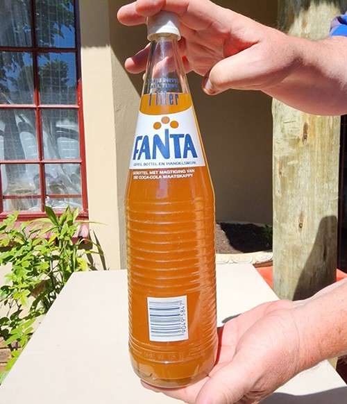 VINTAGE 1970S-1980S RIBBED FANTA 1L GLASS BOTTLE STILL FULL AND UNOPENED LABELS IN ENG AND AFR