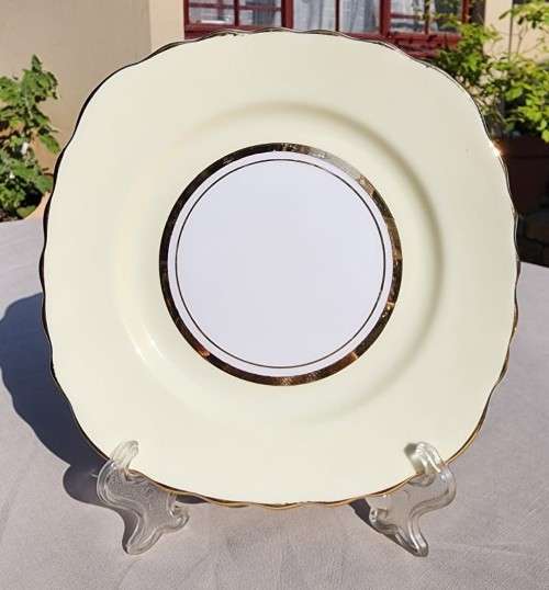 A WW2 ERA 1939 MARKED COLCOUGH CHINA TRIO IN HARLEQUIN BALLET LEMON YELLOW PATTERN (1ST OF 6)