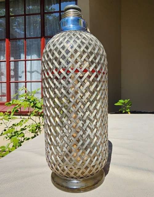 ENGLISH VINTAGE (CIRCA 1920-1950) SODA SIPHON BOTTLE WITH STEEL WIRE MESH