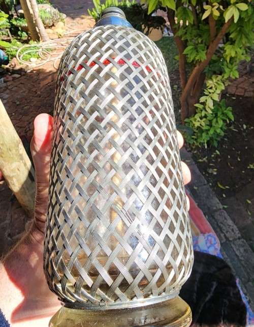 ENGLISH VINTAGE (CIRCA 1920-1950) SODA SIPHON BOTTLE WITH STEEL WIRE MESH