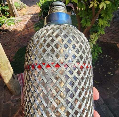 ENGLISH VINTAGE (CIRCA 1920-1950) SODA SIPHON BOTTLE WITH STEEL WIRE MESH