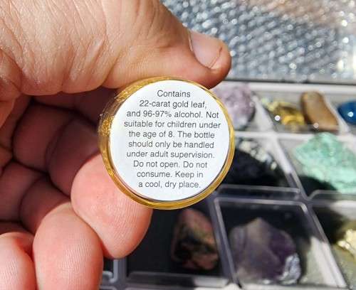 VALUABLE 22K GOLD LEAF IN A ROCK AND MINERAL COLLECTION (2ND OF 3) IN DISPLAY CABINET