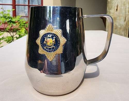 TWO EXCALUBUR SA UNION (PRE 1961) PEWTER TANKARDS AND A SA POLICE (PRE 1994) ATLANTA STAINLESS STEEL