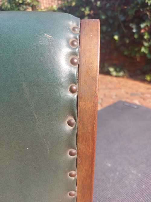 ANTIQUE X BASE ROCKING FOOT GOUT STOOL WITH GREEN TANNED LEATHER UPHOLSTERY