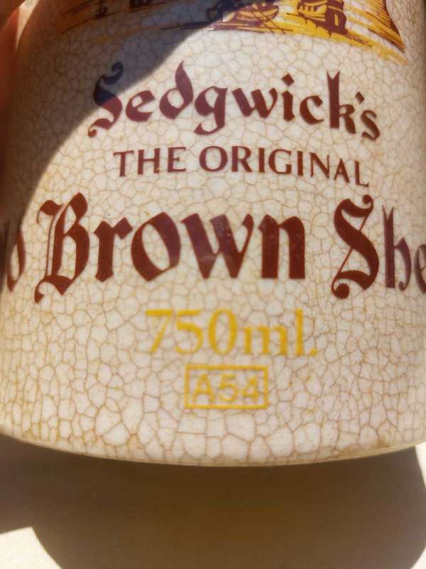 SEDWICKS 1960S THE ORIGINAL OLD BROWN SHERRY 750ML ENAMELLED CERAMIC DECANTER SEALED! AND FULL!