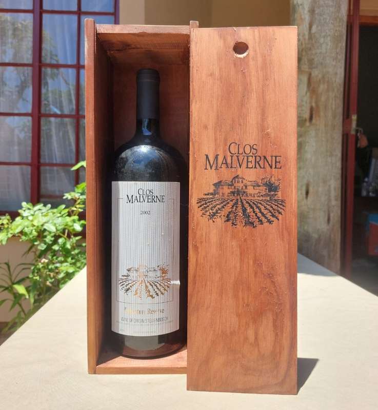 A 2002 CLOS MALVERNE 1,5L DEBENTURE RESERVE IN WOODEN CRATE  A UNIQUE BLEND OF PINOTAGE AND MERLOT