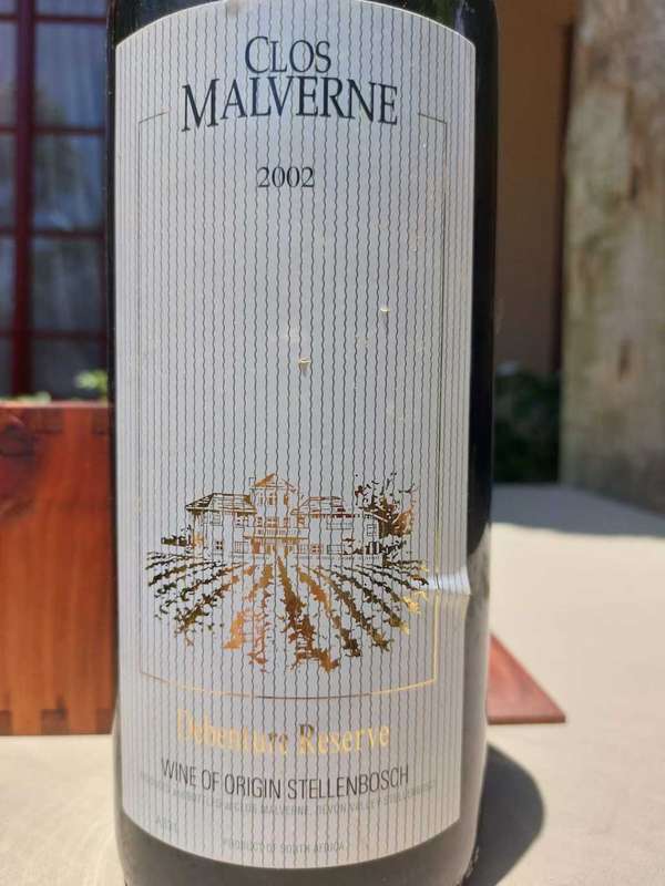 A 2002 CLOS MALVERNE 1,5L DEBENTURE RESERVE IN WOODEN CRATE  A UNIQUE BLEND OF PINOTAGE AND MERLOT