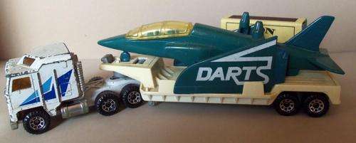 MATCHBOX LOW BED TRAILER WITH DARTS ALPHA JET AND KENWORTH HAULER.