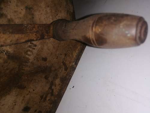 Grinding stone in cast iron holder with handle - very old and with some damage