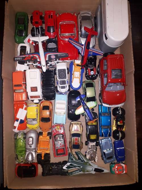 Box of assorted die cast cars and planes