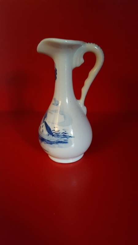 Lucia ware, Bud vase. Hand Painted in Delft Blue. Signed by the Artist.