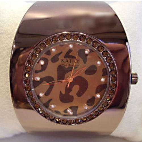FUNKY, BLING!! KATHY VAN ZEELAND POLISHED OVAL CUFF WATCH WITH ANIMAL PRINT FACE