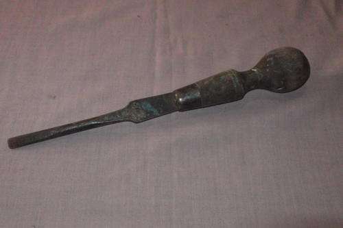 Old flat screwdriver with wooden handle