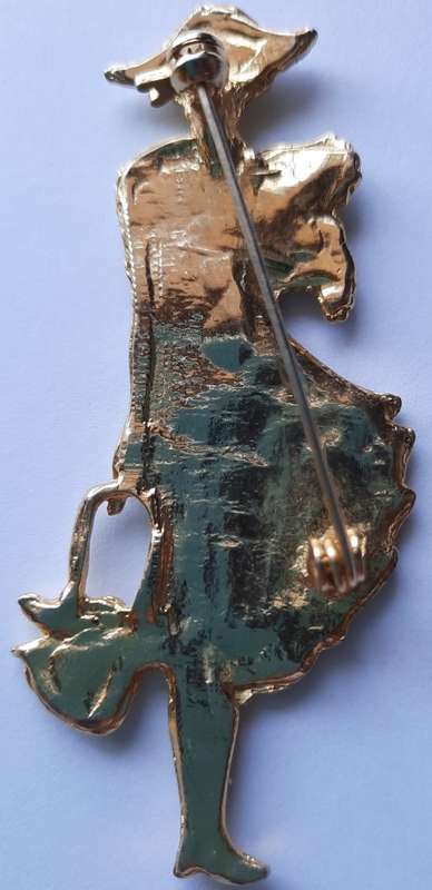 Elegant  woman with a dog and bag brooch