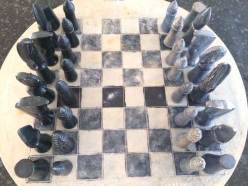 Soap stone chess set and board.