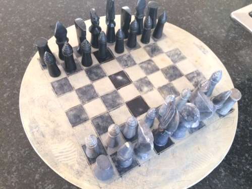 Soap stone chess set and board.