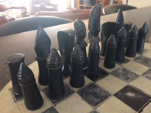 Soap stone chess set and board.