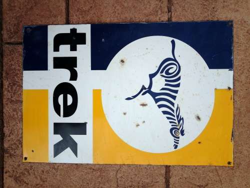 Trek metal painted sign