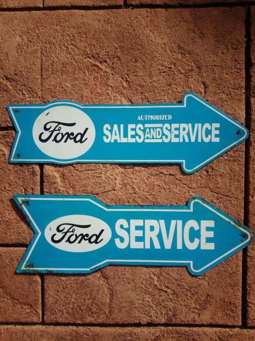 Ford sales and service arrow signs