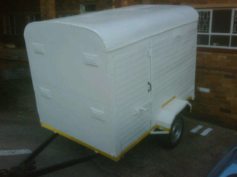 Refurbished Closed box trailer with back and side doors.