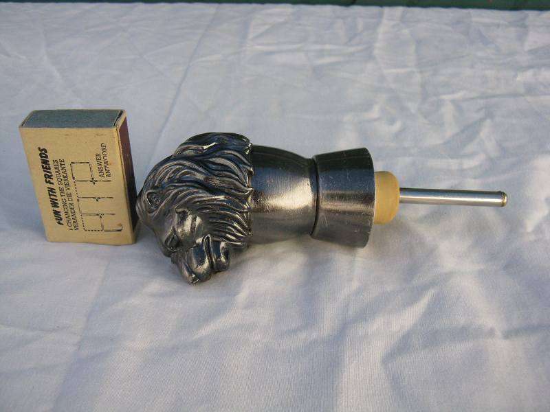 LIONS HEAD POURER.