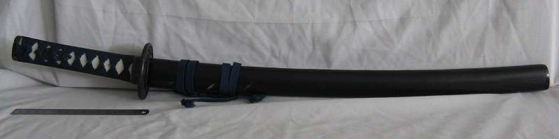 SWORD WITH CANE SCABBARD PURCHASED BY PREVIOUS OWNER IN JAPAN IN 1984.