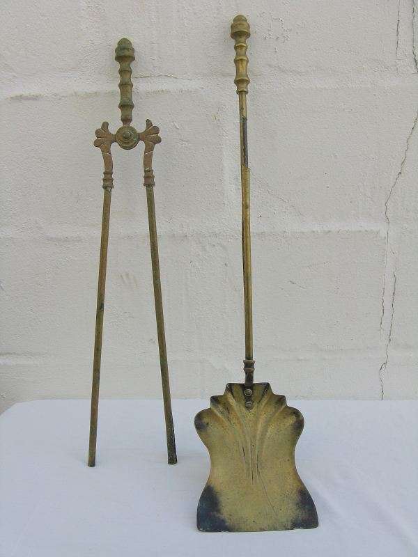 FIRE POKER AND SHOVEL. METAL INNER, BRASS EXTERIOR. PLEASE NOTE CONDITION.