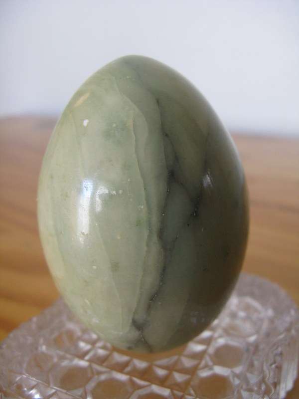 STONE EGG. +/- 150g. Height = +/- 7cm x Circumference = 14.5cm.