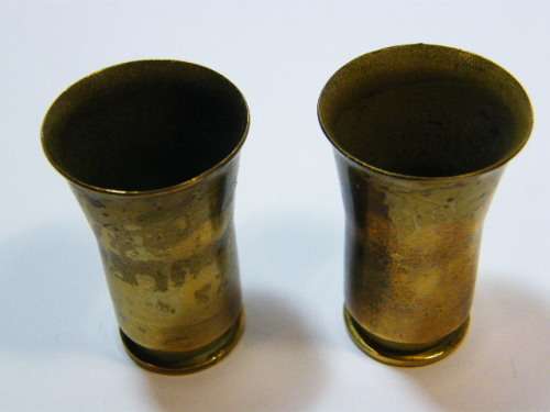 Pair of trench art shot glasses made from bullet casings - as per photo