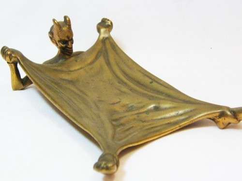 Antique brass devil ashtray with horns for cigarette stand