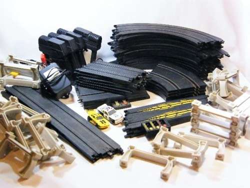 Lot of 38 slot car racing tracks - assorted mostly Marchon with 4 controllers, power supply & 2 cars