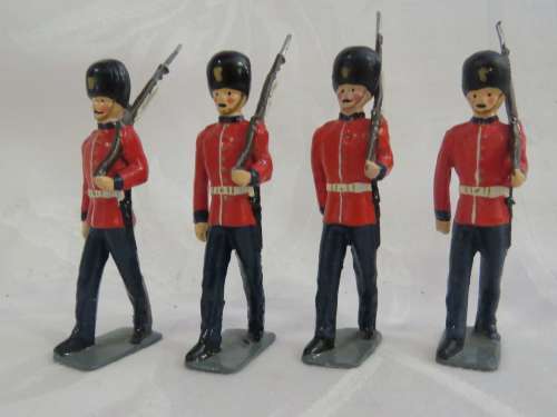 Set of 4 British lead soldiers -  Gueards marching with rifles