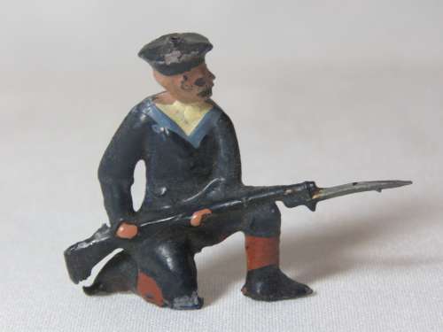 Royal Navy lead soldier kneeling with knife