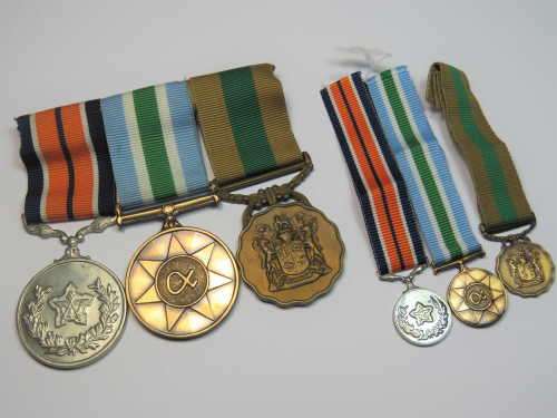 Set of 3 SADF service medals with miniatures issued to Sergeant K.G. Hechter