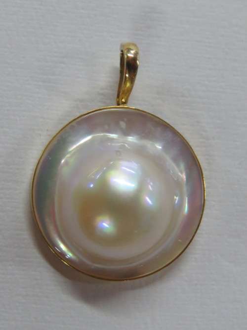 Unusual Mabe pearl pendant set in 14K gold