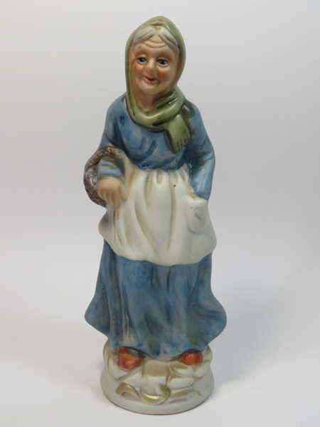 Grandma with basket porcelain figurine