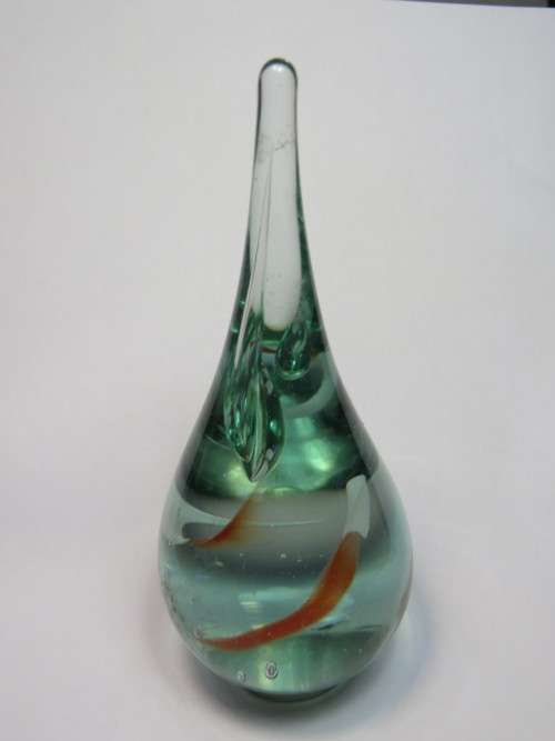 Hand blown glass paperweight with metal footpiece
