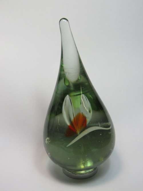 Hand blown glass paperweight with metal footpiece