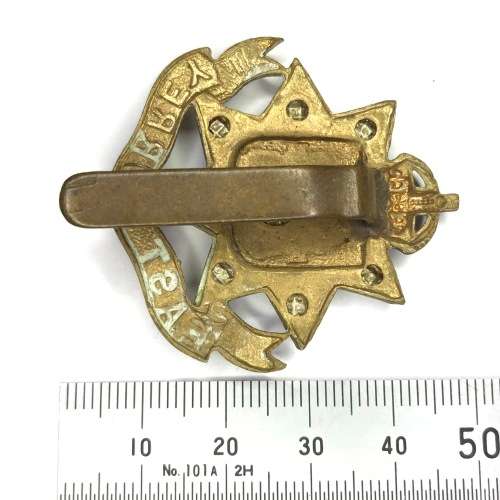 East Surrey regiment cap badge with slide - crown