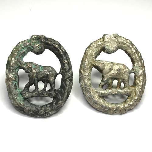 Pair of Non European sand cast collar badges