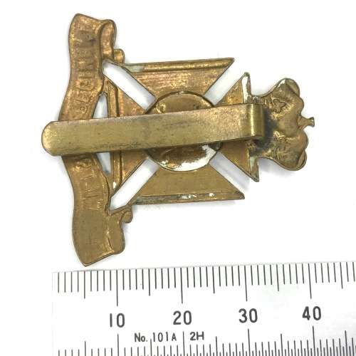 The Wiltshire regiment cap badge with slide