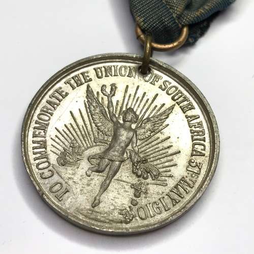 1910 Union of South Africa commemoration medallion with springbok clip