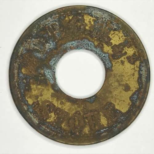 De Beers Consolidated mines one shilling token with central hole