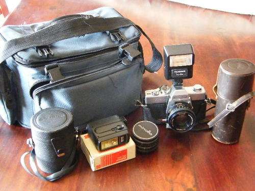 Minolta SRT100x camera package with a lot of extra lenses and camera bag