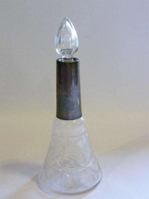 Antique perfume bottle with hallmarked silver top as per photo